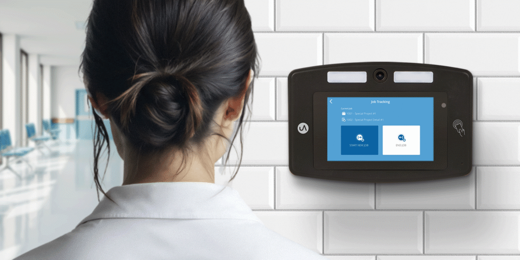 Employee entering work and verifying identity on a biometric time clock system